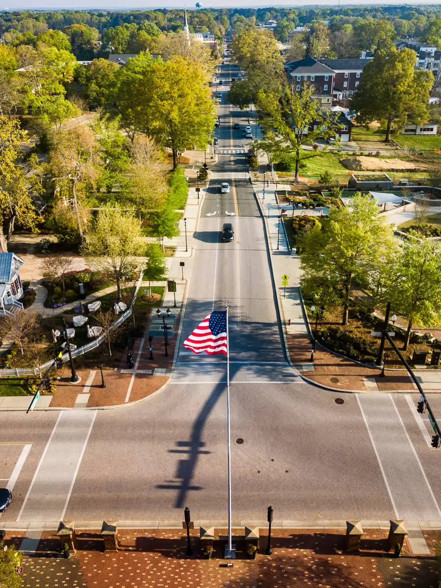 American flag on Cary's historic downtown street, embodying the spirit of the Guess-White-Ogle House.